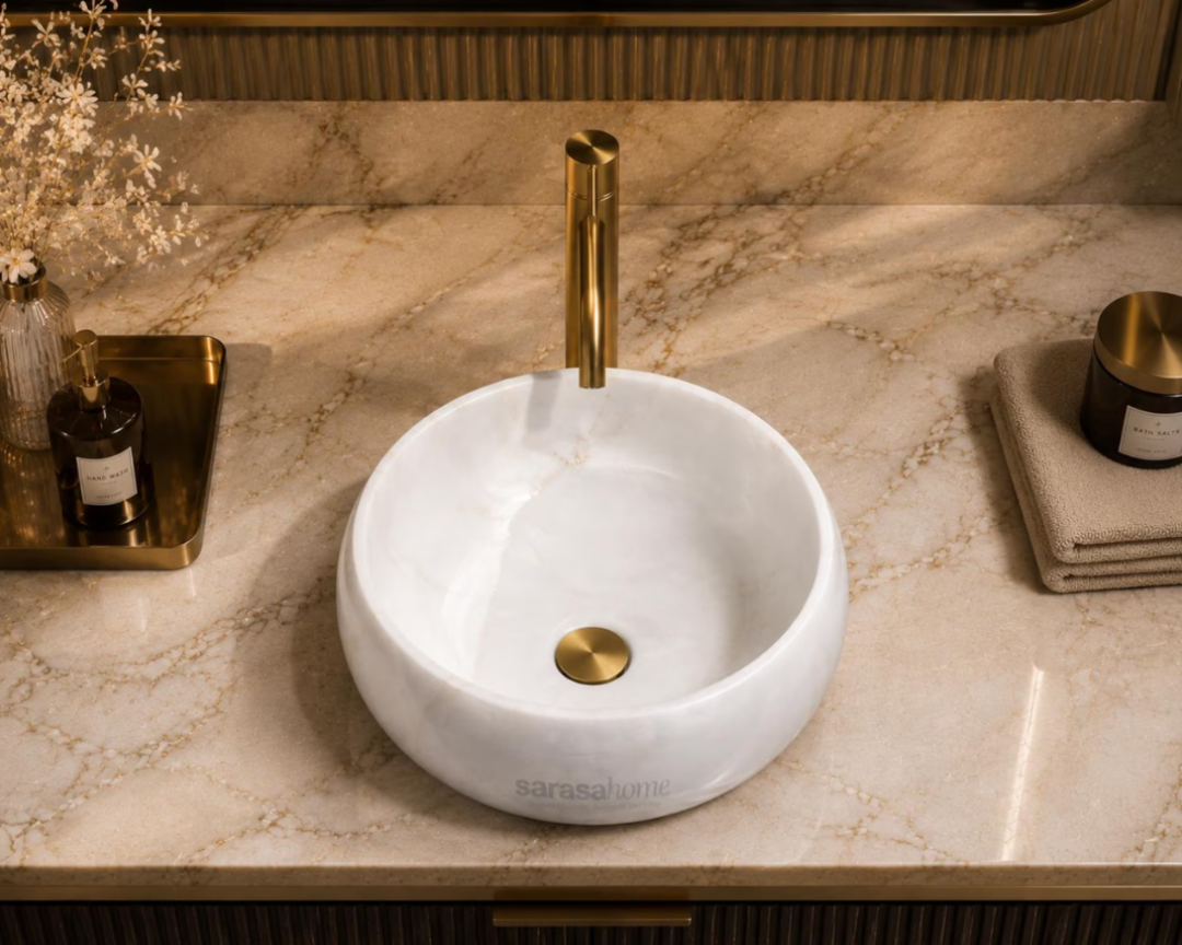 White marble round vessel sink with scalloped design