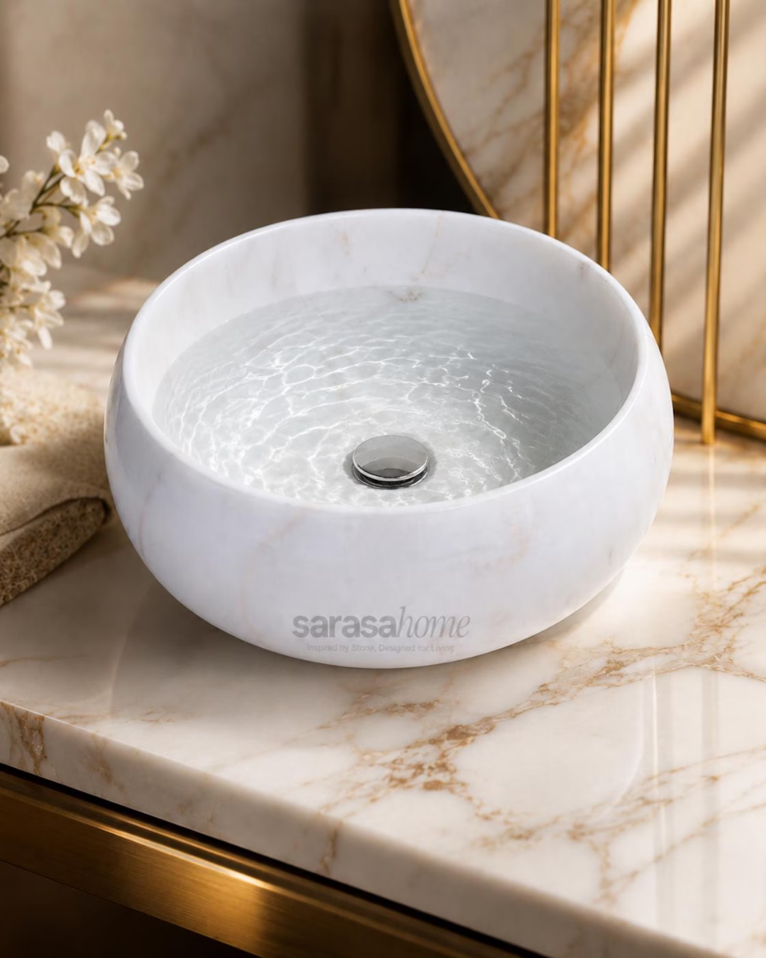 Scalloped white marble bathroom sink side view